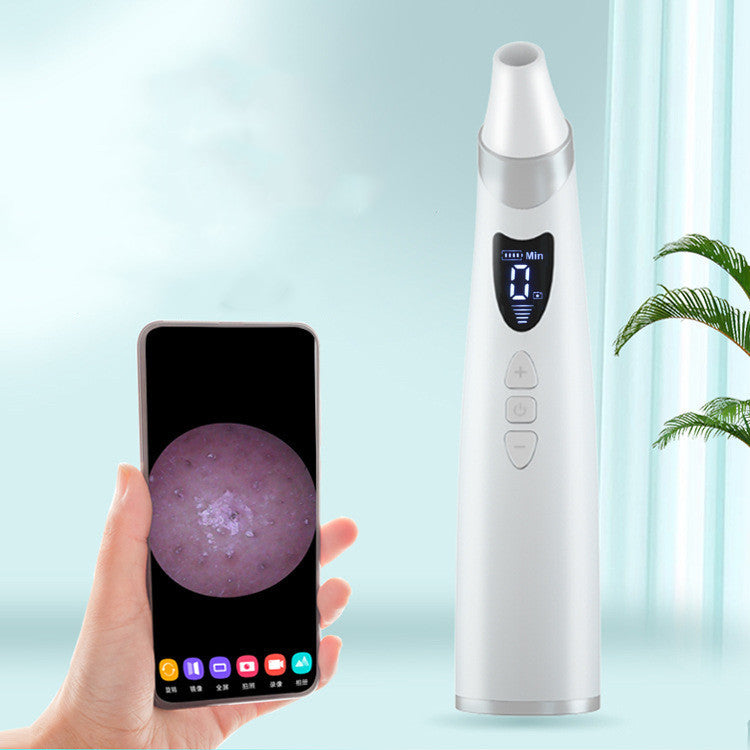 White electric blackhead remover with digital display next to smartphone showing skin close-up