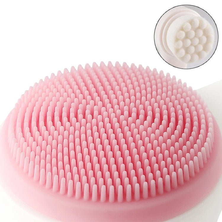 Pink silicone face massage and washing brush with soft bristles for gentle facial cleansing