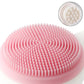 Pink silicone face massage and washing brush with soft bristles for gentle facial cleansing
