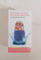 Silicone facial ice roller for skin care with blue handle and clear massage ball in packaging